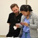 Summer interns Nicholas Davis and Michelle Shin reading a manual during a simulation in the CELA Lab. 