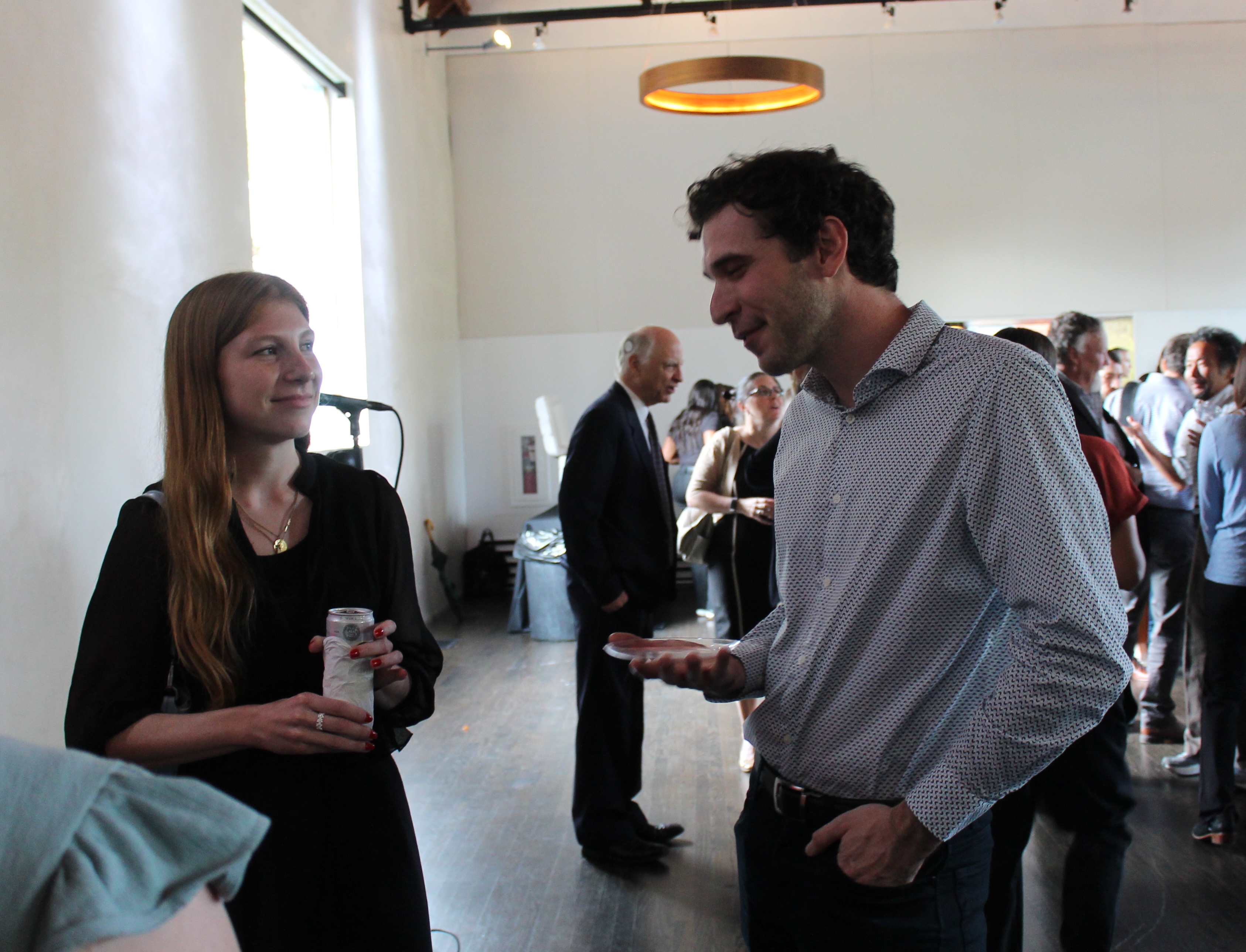 Tess Stopczynski and Trey McGonigle chat at a department reception