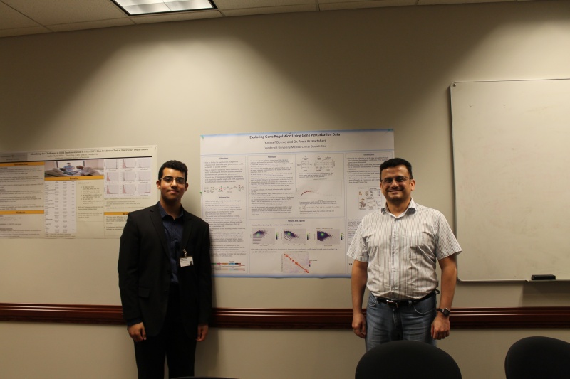 Youssef Botros and Amir Asiaee in front of their poster