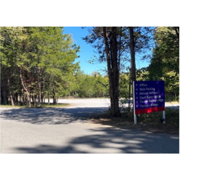 Sign and trees at entrance to the Main Parking area