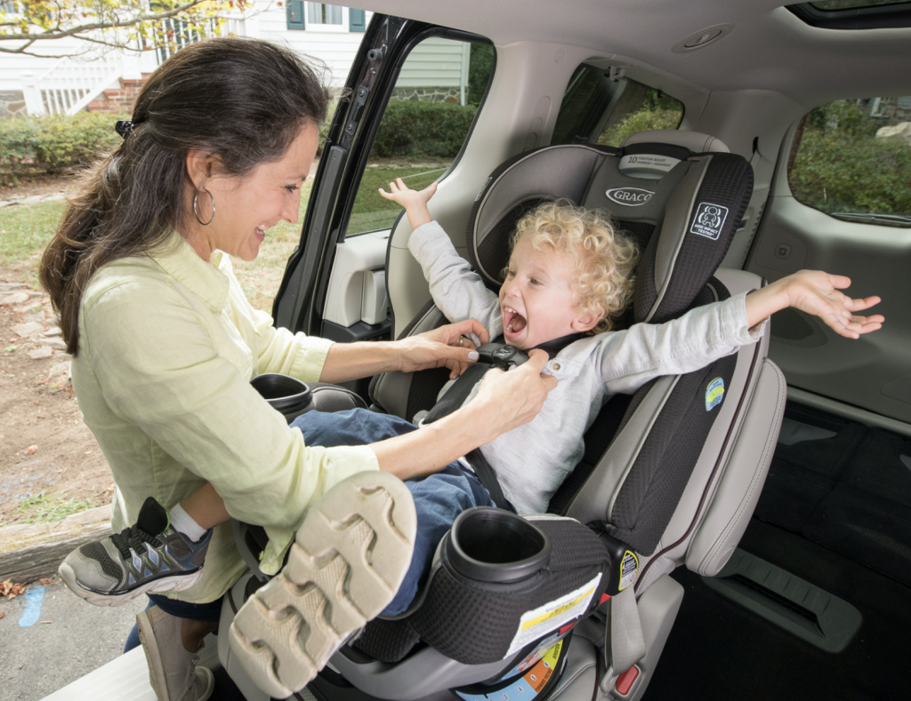 Happy kid in car seat