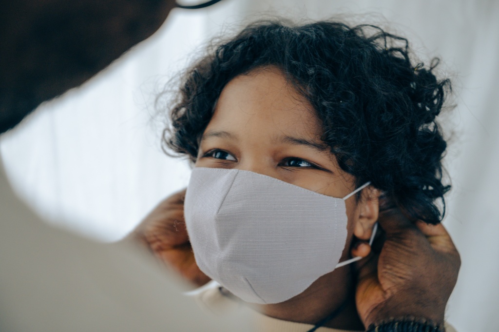 Child wearing facial mask