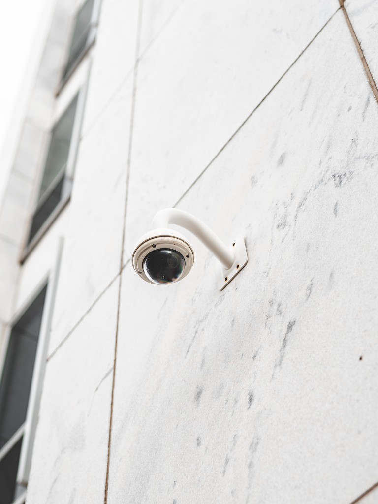 security camera attached to the side of a building