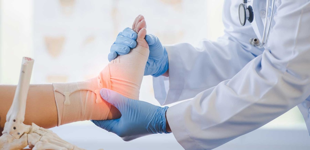 Doctor attending to patient's foot
