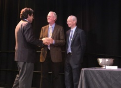 John Gore, winner of the Earl Sutherland Prize for achievement in research, is congratulated by Chancellor Nicholas S. Zeppos and Faculty Senate Chair Donald W. Brady on Aug. 22 at the 2013 Fall Faculty Assembly.